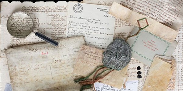 Collection of ephemera and magnifying glass