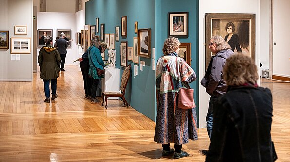 Visitors in the 'No Welsh Art' exhibition at the National Library