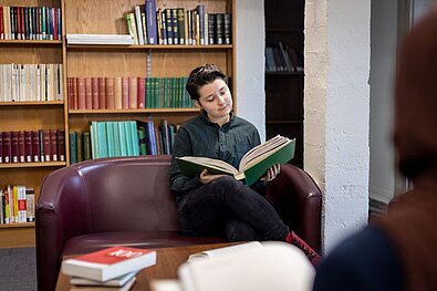 A visitor reading in the Library's Reading Room