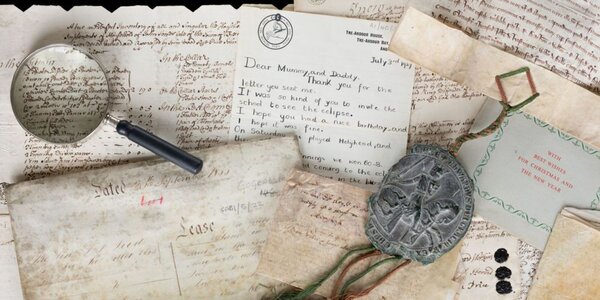 Collection of ephemera and magnifying glass