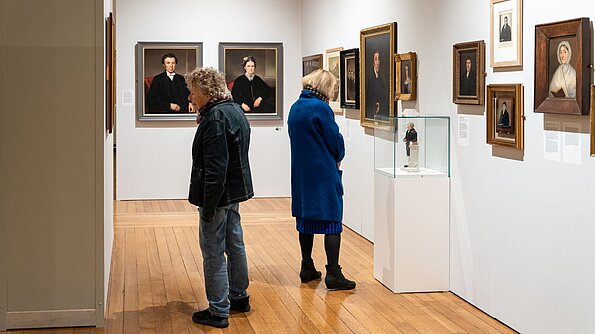 Visitors in the 'No Welsh Art' exhibition at the National Library