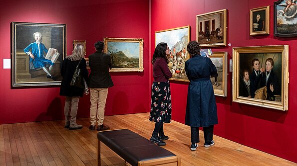 Visitors in the 'No Welsh Art' exhibition at the National Library
