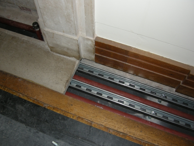 Laying heating pipes under the marble plinths of the Central Hall npc