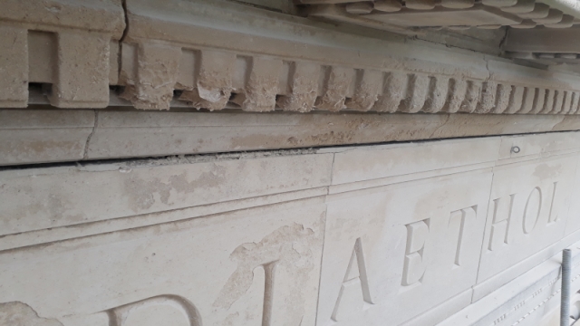 Restoration work on the stonework name of the Library npc