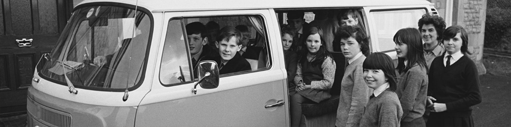 Children in and around a van