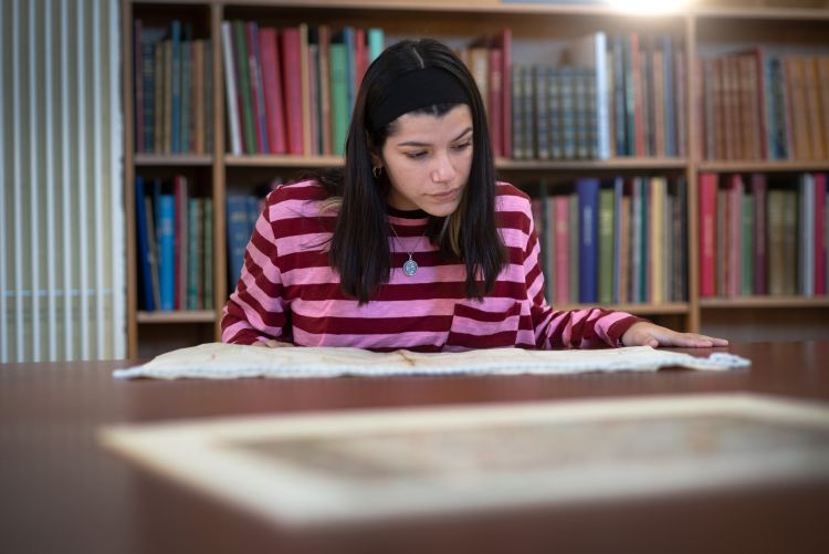 A reader looking at documents in the Library's Reading Room