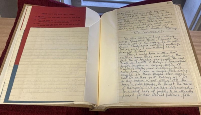 The manuscript NLW MS 10811D shown open on a page showing poetry and notes by Idris Davies h