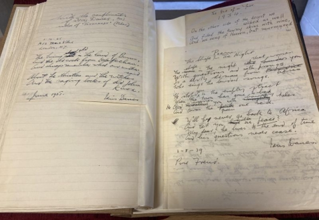The manuscript NLW MS 10811D shown open on another page showing notes and poetry by Idris Davies h