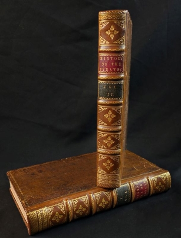 Both volumes of the Library's copy of "The General Historie of the Pyrates" cc