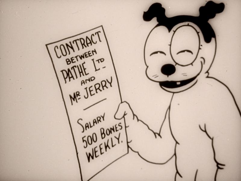 A screen shot of the first Jerry the Tyke film, showing Jerry, an animated 'dog', holding a piece of paper that reads 'Contract between Pathe Ltd and Mr. Jerry, Salary 500 Bones Weekly.' Jerry is looking at the camera with a grin.