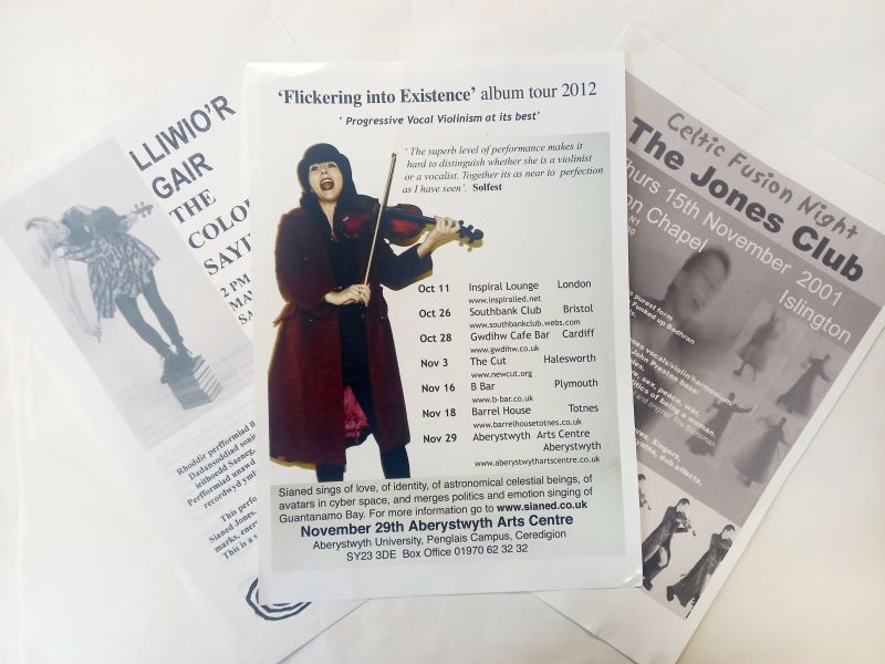 Three posters from the Sianed Elin Jones collections advertising various performances, with the middle poster featuring an image of Sianed Jones playing the fiddle on a white background